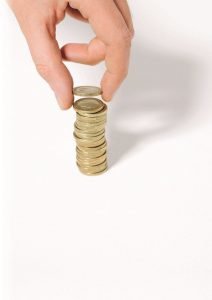 ©LAURENT HAMELS/6PA/MAXPPP. MAIN - HAND. Hand stacking coins